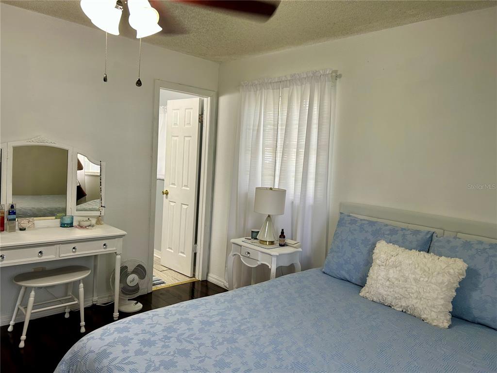 304 Bell Street Wauchula, FL 33873 - Photo 28 of 41 a bedroom with a bed and a chandelier
