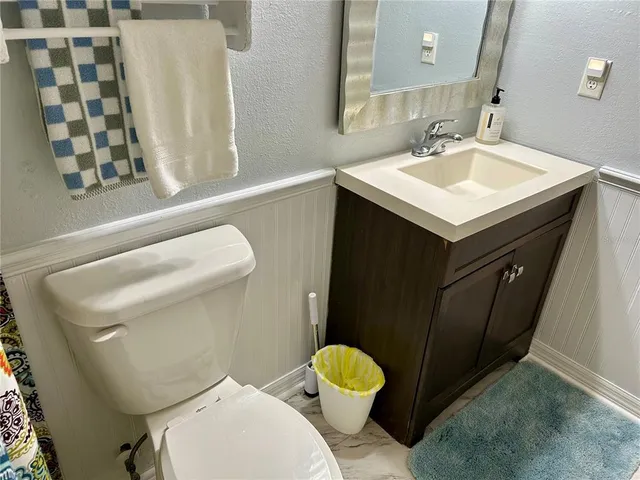 a bathroom with a sink and mirror