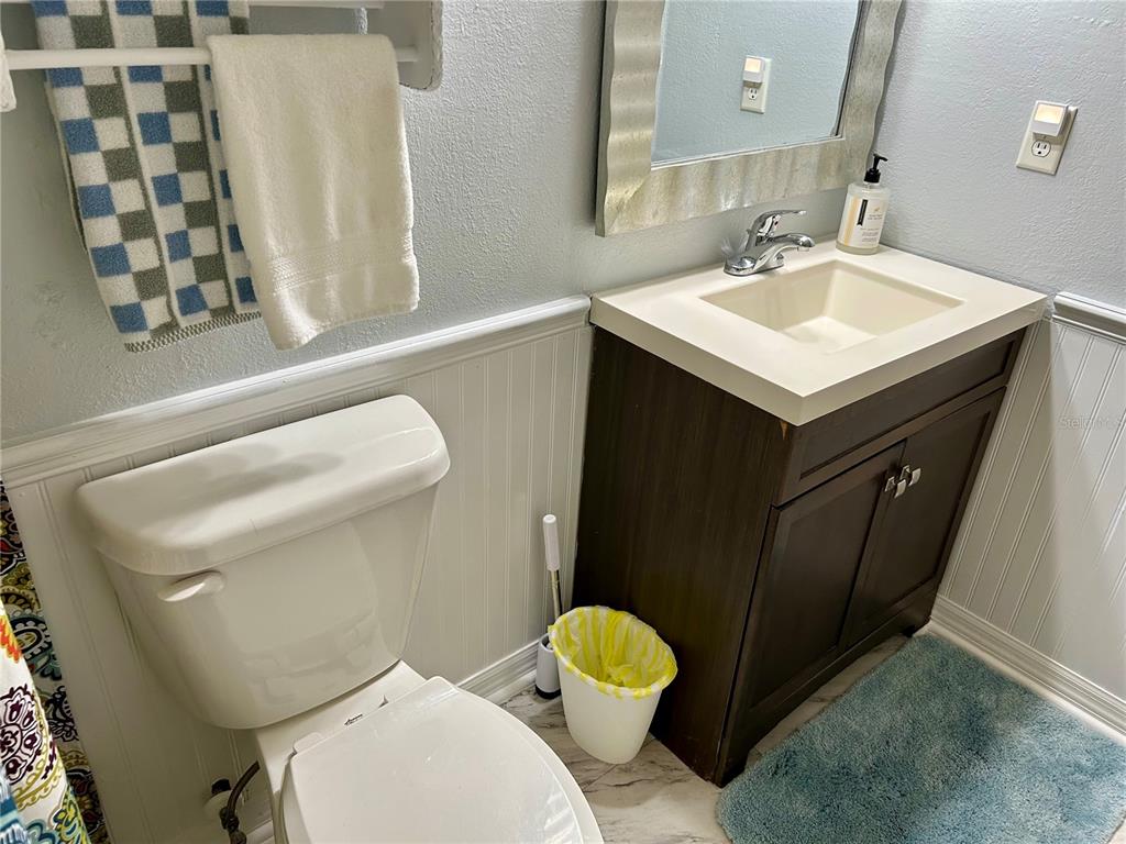 304 Bell Street Wauchula, FL 33873 - Photo 40 of 41 a white toilet sitting next to a bathroom sink