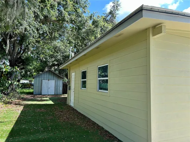a backyard of a house with lots of green space