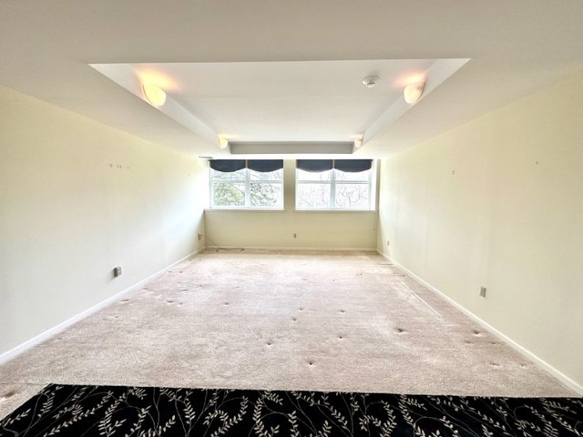140 High Street, Unit 201 Westerly, RI 02891 - Photo 5 of 19 Great room with stylish accent carpeting