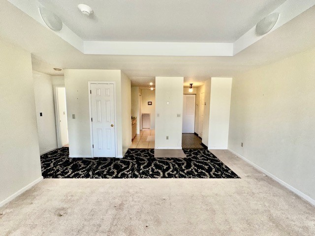 140 High Street, Unit 201 Westerly, RI 02891 - Photo 6 of 19 View from great room towards kitchen and entryway with tray ceiling
