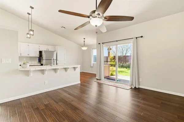 a view of kitchen with stainless steel appliances refrigerator oven and stove