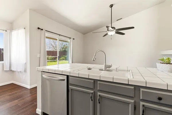 a kitchen with a sink and a window