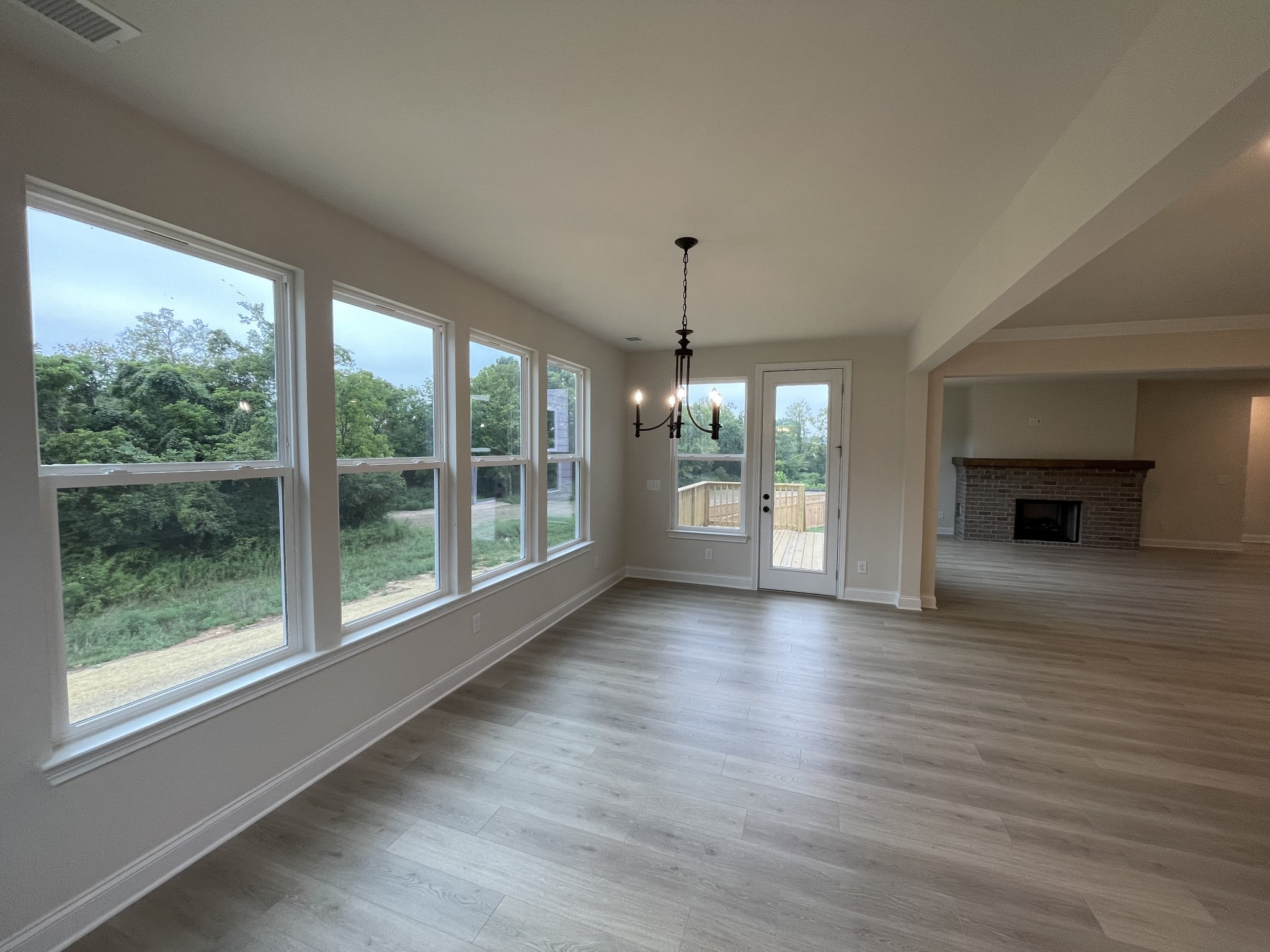 213 Phillips Bend Spring Hill, TN 37174 - Photo 12 of 49 a view of empty room with wooden floor and fireplace