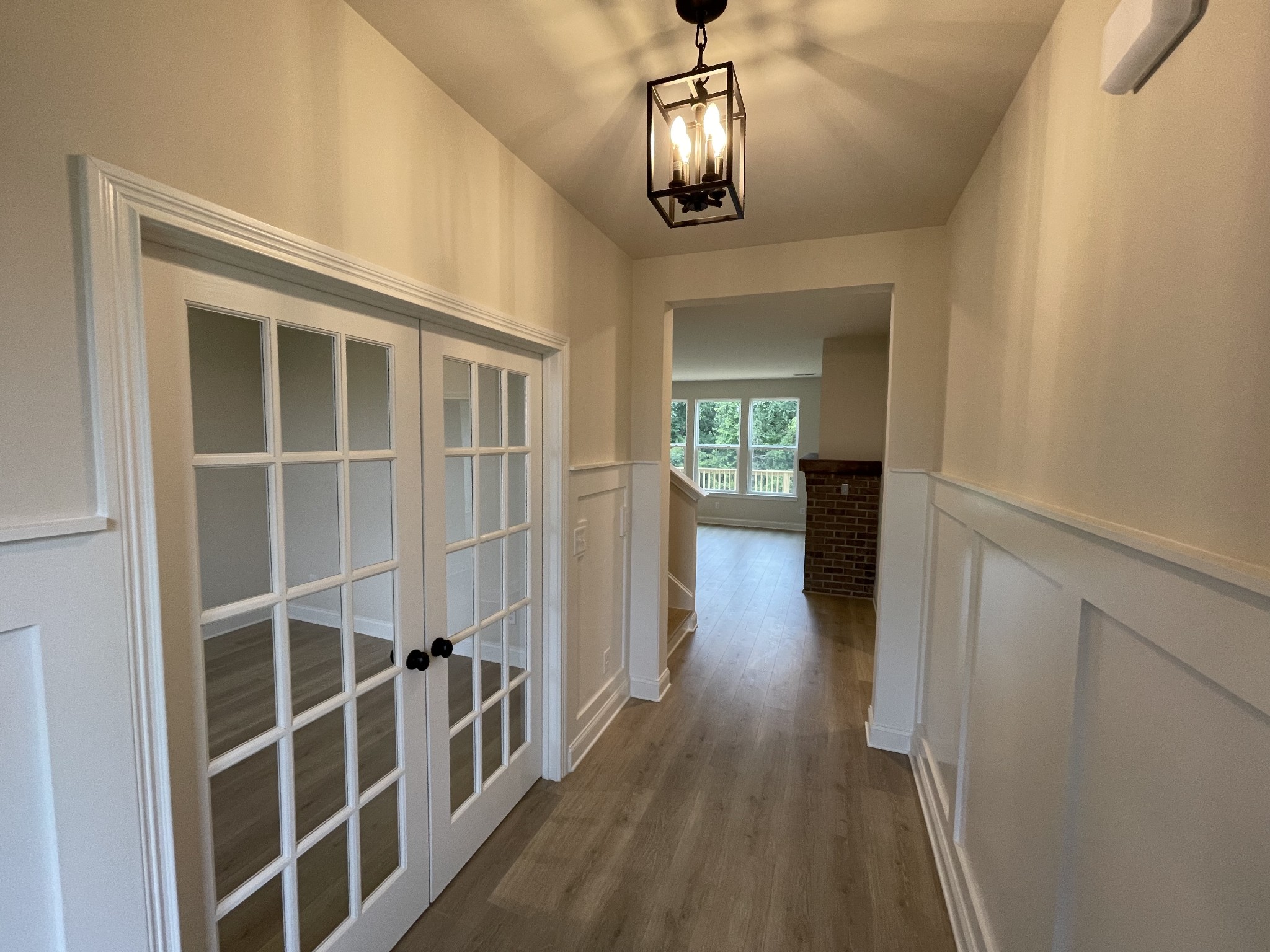 213 Phillips Bend Spring Hill, TN 37174 - Photo 4 of 49 a view of a hallway with wooden floor and workspace