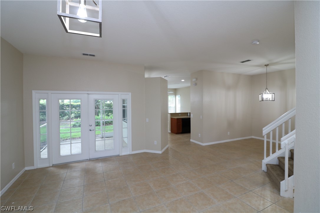 8889 Spring Mountain Way Fort Myers, FL 33908 - Photo 2 of 17 a view of an empty room with a window