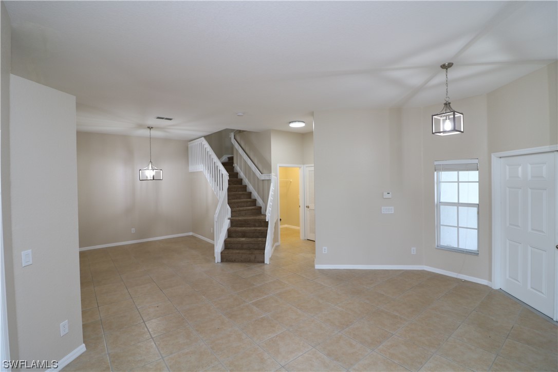 8889 Spring Mountain Way Fort Myers, FL 33908 - Photo 3 of 17 an empty room with windows and pillars in it