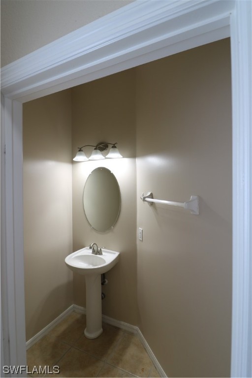 8889 Spring Mountain Way Fort Myers, FL 33908 - Photo 8 of 17 a bathroom with a sink and a mirror