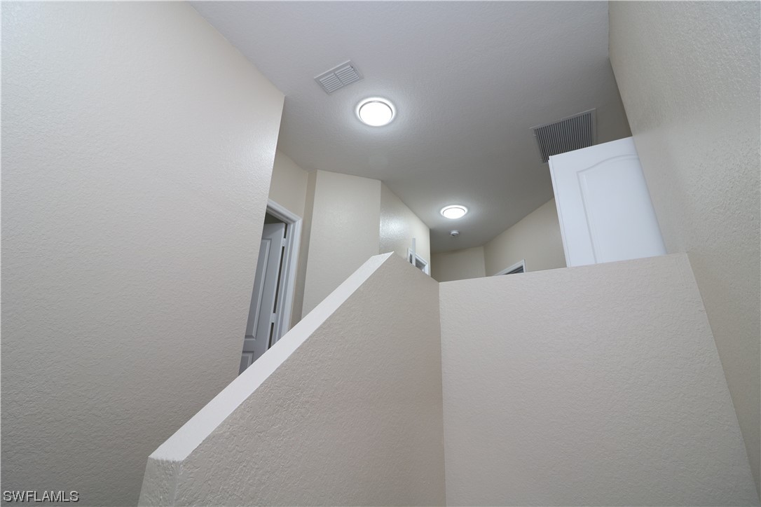 8889 Spring Mountain Way Fort Myers, FL 33908 - Photo 9 of 17 a view of a hallway