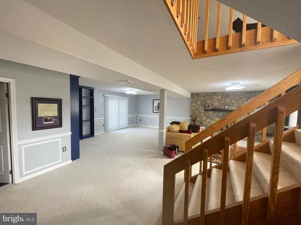 a bedroom with furniture and a fireplace