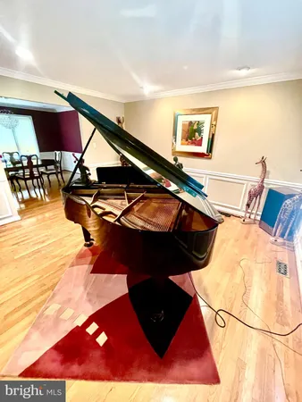 a balcony with table and chairs