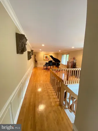 a view of a livingroom with furniture window and wooden floor