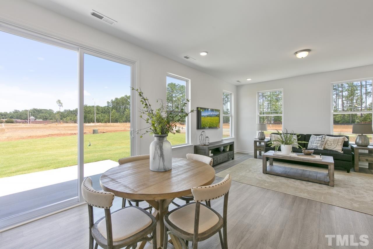 196 Lennei Lane Garner, NC 27529 - Photo 17 of 46 a view of a dining room with furniture window and outside view