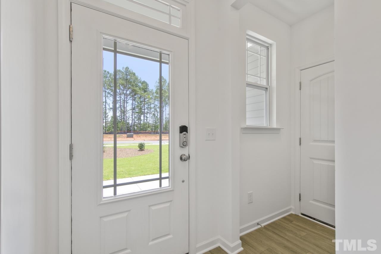 196 Lennei Lane Garner, NC 27529 - Photo 20 of 46 a view of an entryway with wooden floor