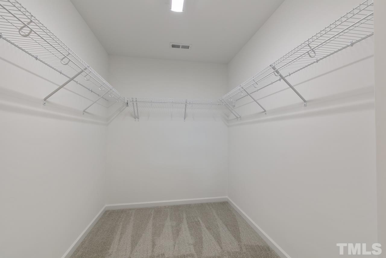 196 Lennei Lane Garner, NC 27529 - Photo 35 of 46 a view of a room with racks on the wall