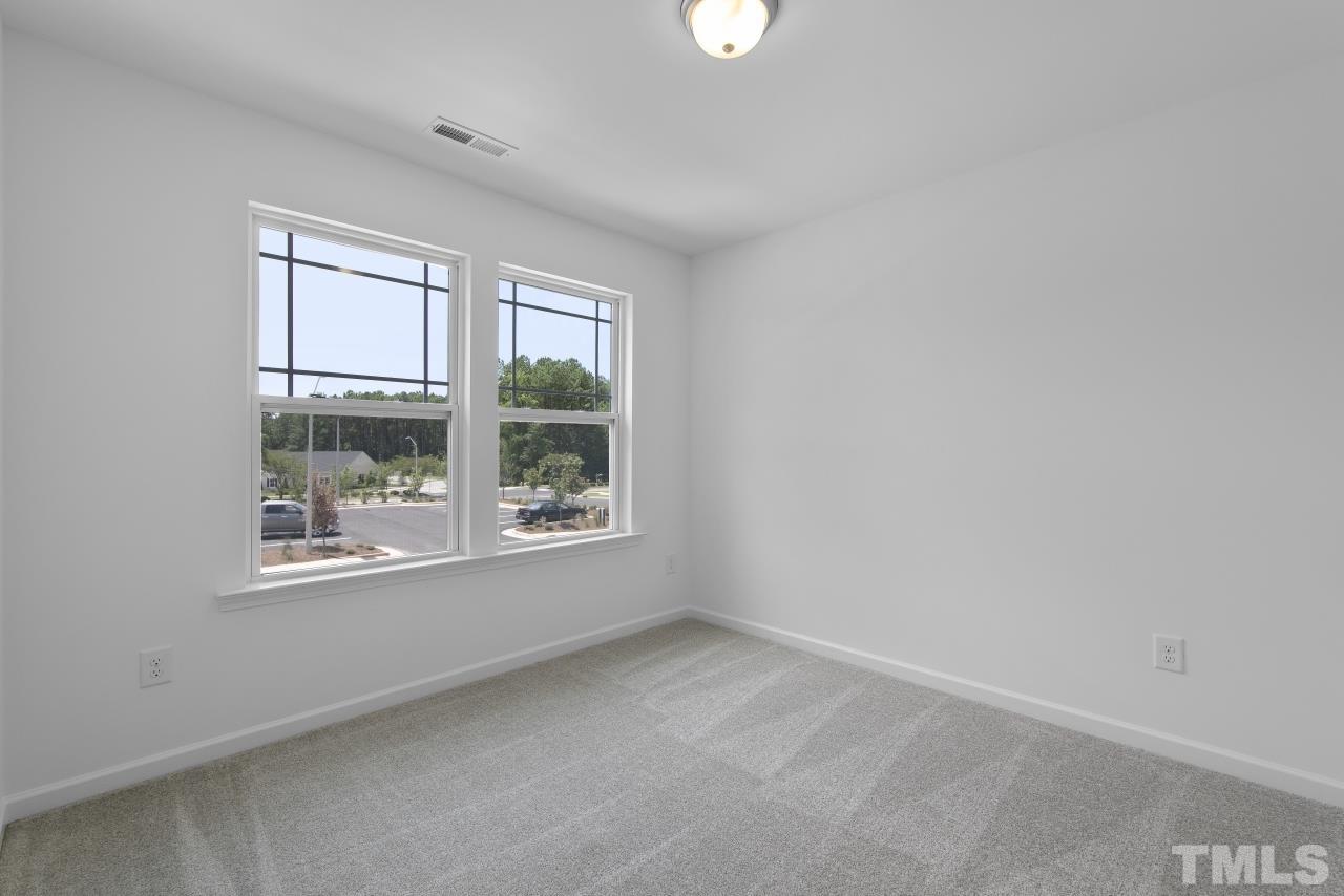 196 Lennei Lane Garner, NC 27529 - Photo 36 of 46 an empty room with windows