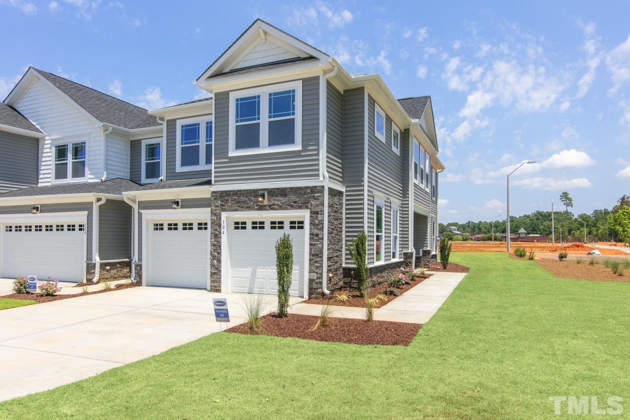 196 Lennei Lane Garner, NC 27529 - Photo 4 of 46 a front view of a house with a yard and porch