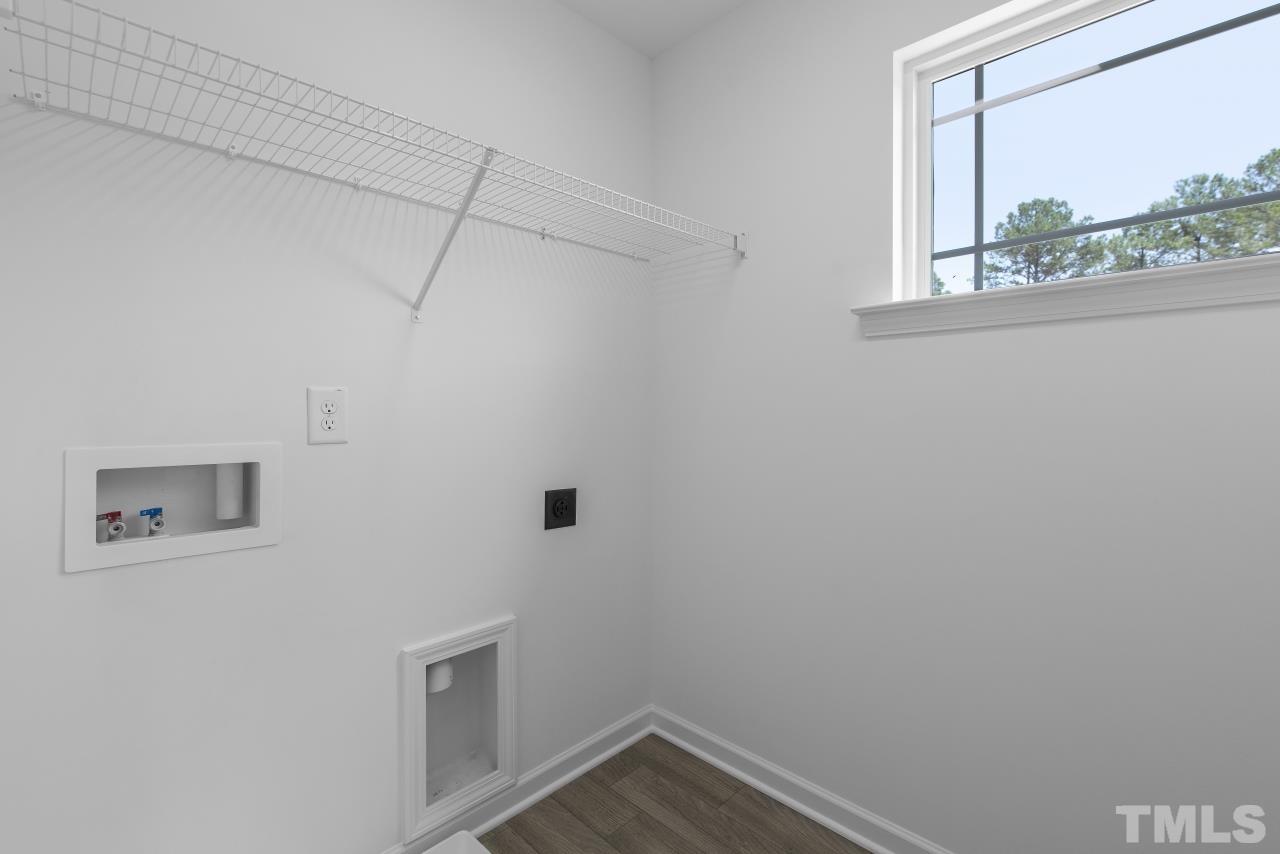 196 Lennei Lane Garner, NC 27529 - Photo 42 of 46 a view of a small space with wooden floor and a window