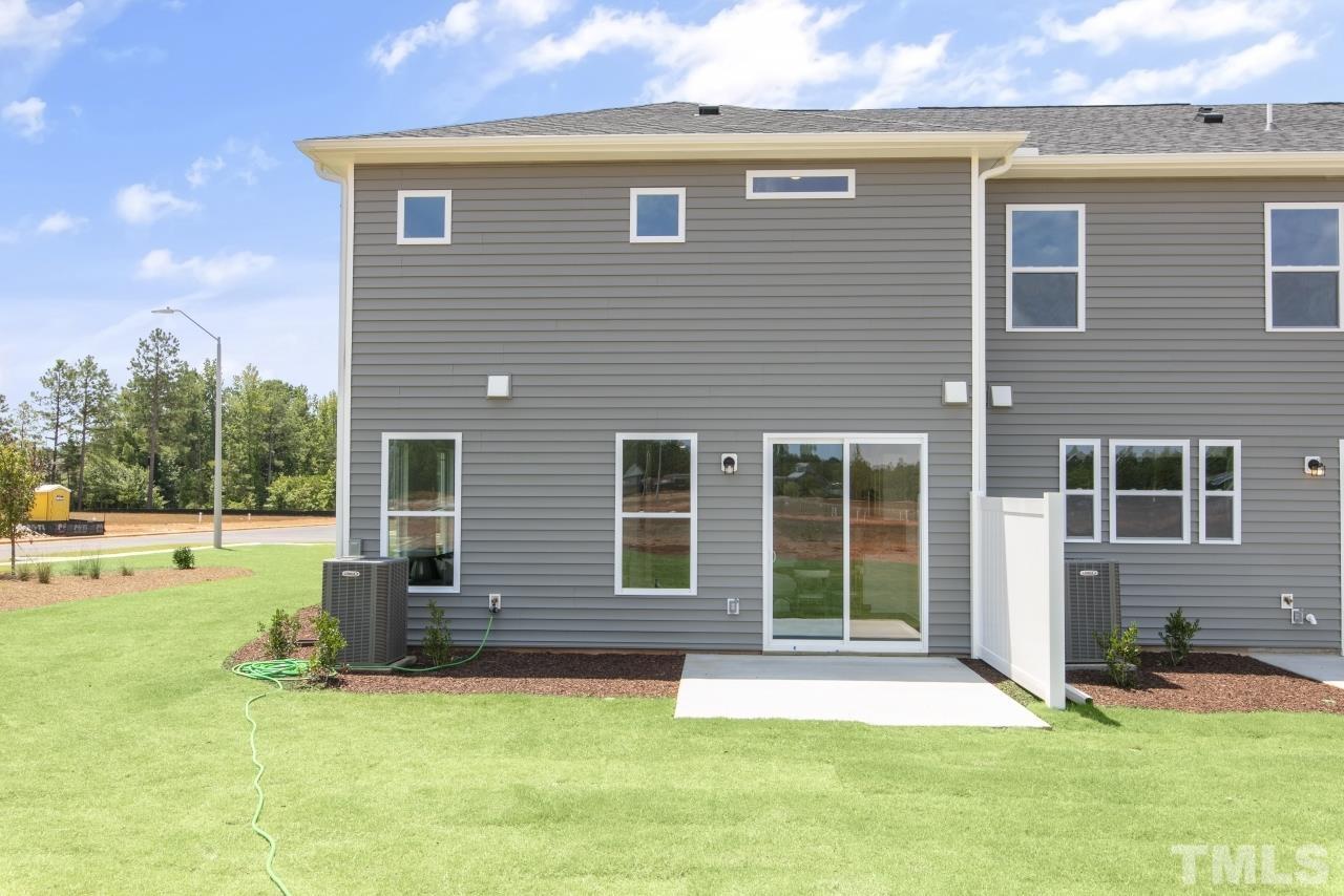 196 Lennei Lane Garner, NC 27529 - Photo 44 of 46 a view of a house with a yard and sitting area