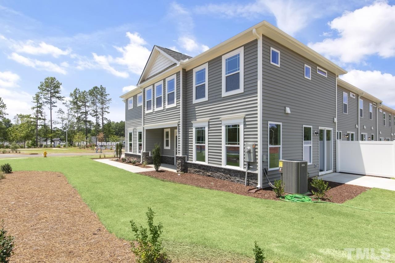 196 Lennei Lane Garner, NC 27529 - Photo 5 of 46 a front view of house with yard and outdoor seating