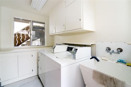 1501-1503 46th Avenue San Francisco, CA 94122 - Photo 11 of 13 a room with a sink and cabinets