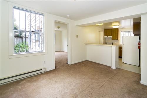 1501-1503 46th Avenue San Francisco, CA 94122 - Photo 12 of 13 a view of empty room with a window and a kitchen