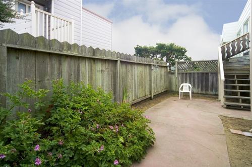 1501-1503 46th Avenue San Francisco, CA 94122 - Photo 13 of 13 a backyard of a house with chairs