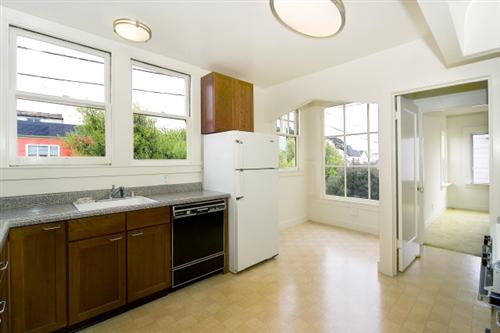 1501-1503 46th Avenue San Francisco, CA 94122 - Photo 6 of 13 a kitchen with a sink stove and refrigerator