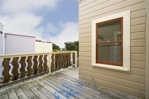 1501-1503 46th Avenue San Francisco, CA 94122 - Photo 10 of 13 a view of a wooden door and a window