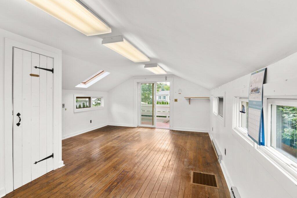 2216 Boston Post Road Darien, CT 06820 - Photo 11 of 31 a view of a big room with wooden floor and windows