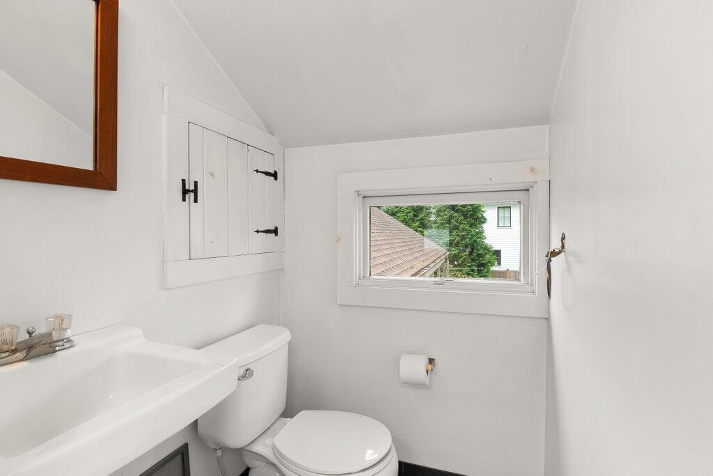 2216 Boston Post Road Darien, CT 06820 - Photo 13 of 31 a white toilet sitting next to a bathroom sink