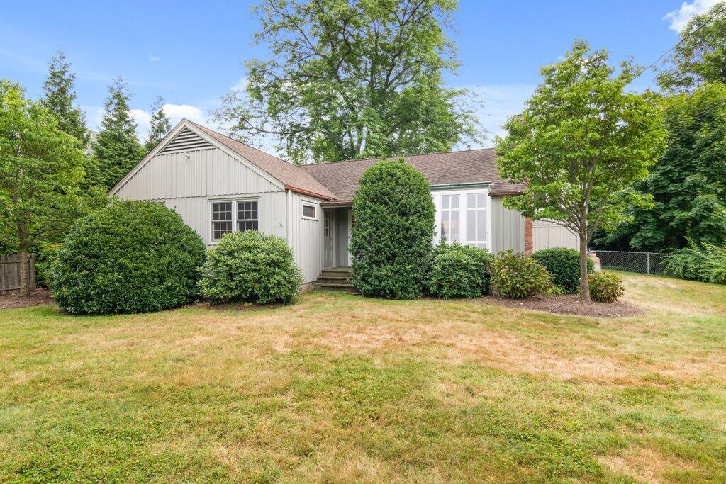 2216 Boston Post Road Darien, CT 06820 - Photo 20 of 31 a view of a house with a yard and garage