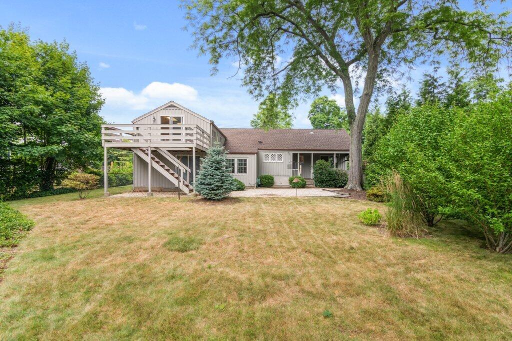 2216 Boston Post Road Darien, CT 06820 - Photo 23 of 31 a front view of a house with a yard