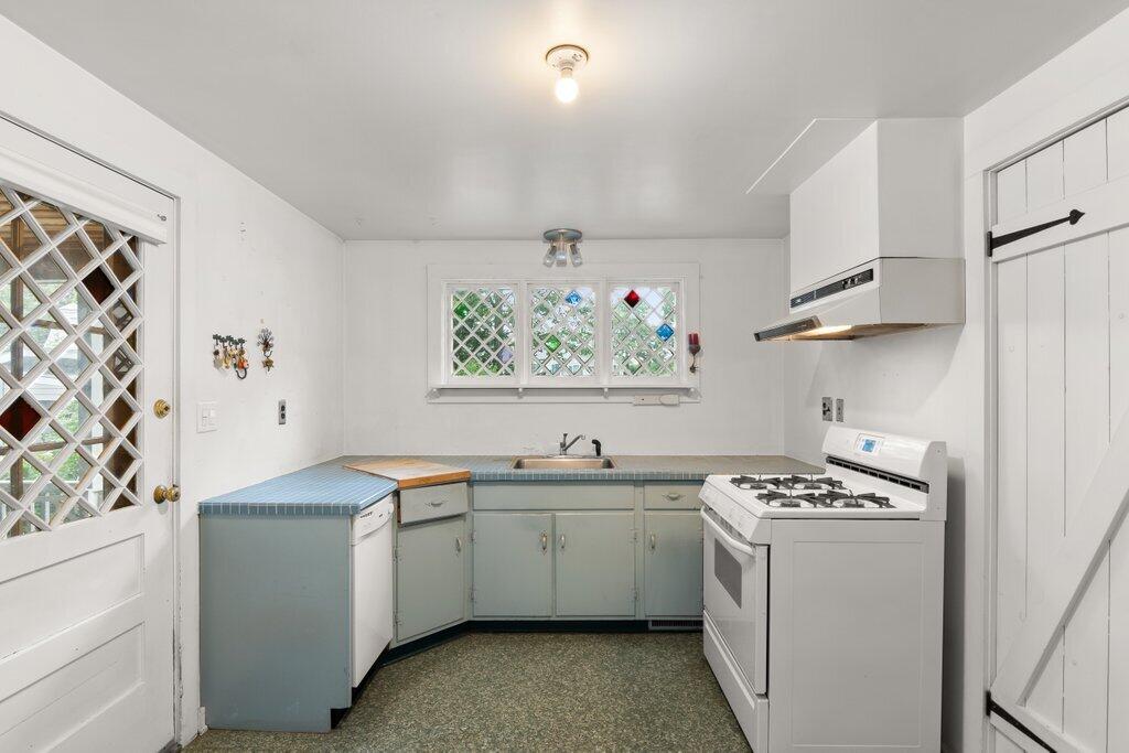 2216 Boston Post Road Darien, CT 06820 - Photo 5 of 31 a kitchen with a sink stove and cabinets