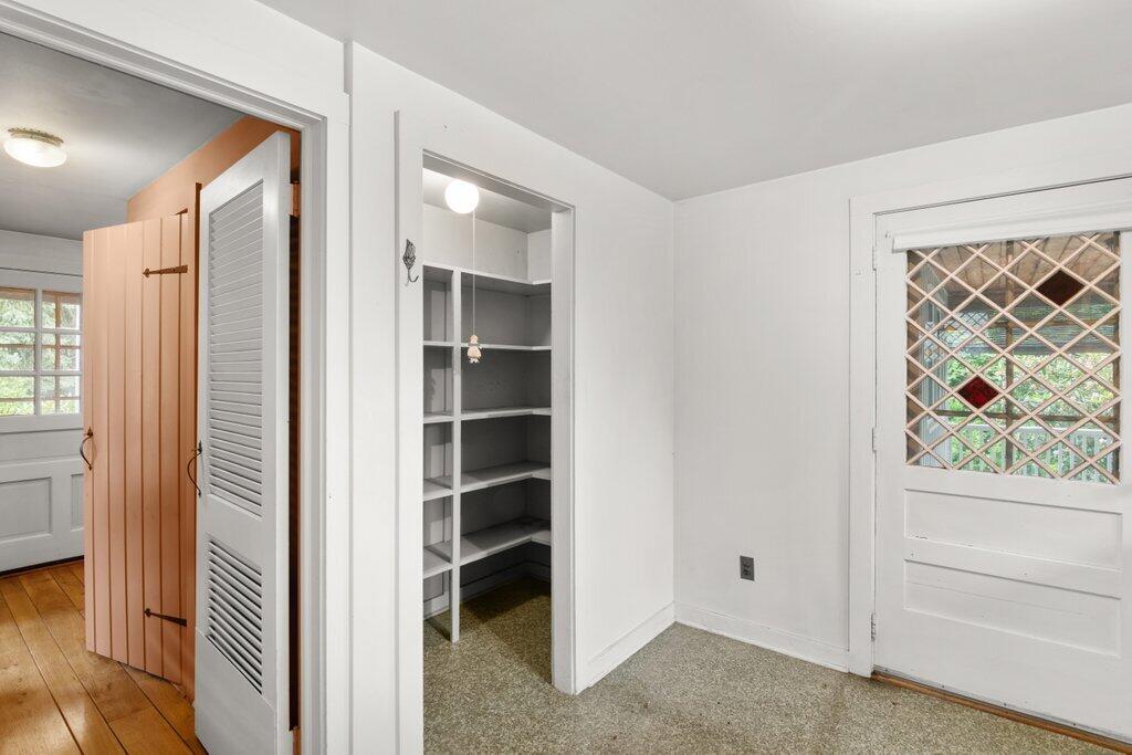 2216 Boston Post Road Darien, CT 06820 - Photo 6 of 31 an empty room with windows and closet