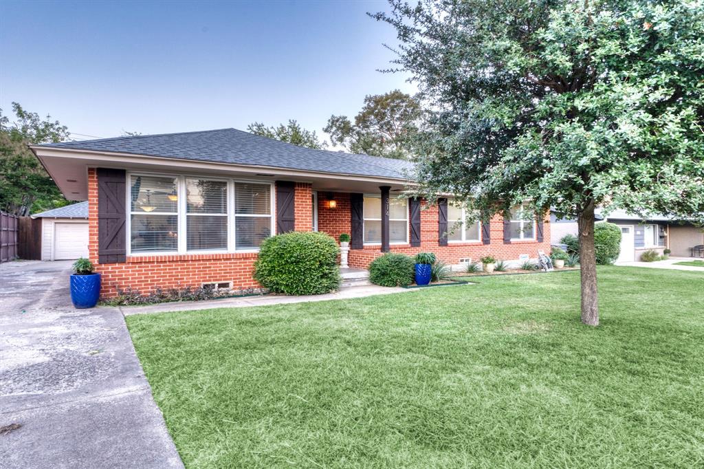 314 Easton Road Dallas, TX 75218 - Photo 2 of 26 a view of a house with a yard
