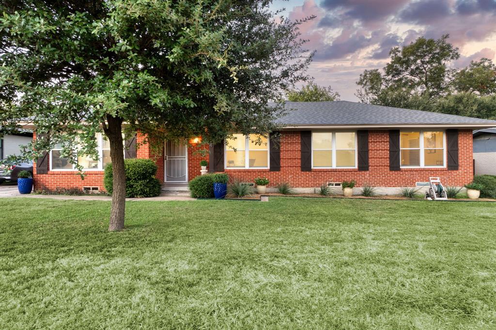 314 Easton Road Dallas, TX 75218 - Photo 26 of 26 a front view of a house with a yard