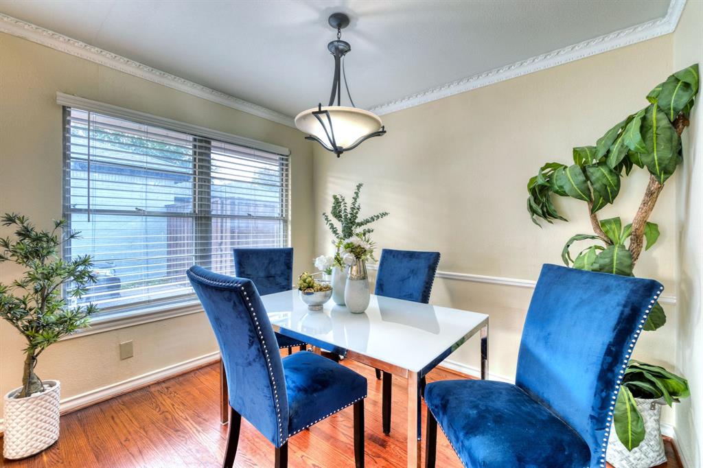 314 Easton Road Dallas, TX 75218 - Photo 7 of 26 a view of a dining room with furniture window and wooden floor