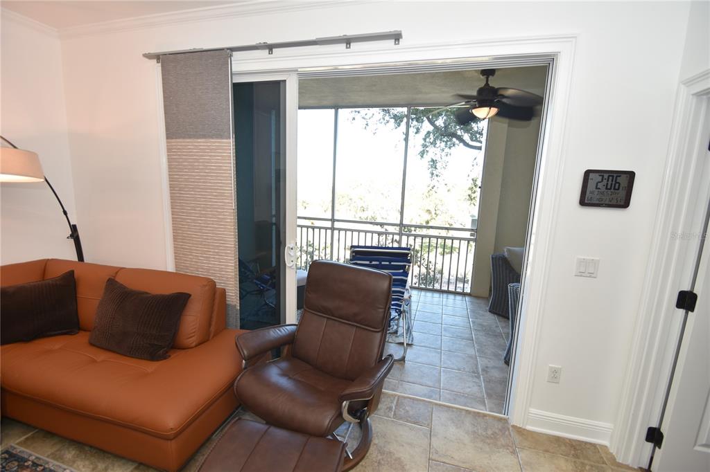146 Palm Coast Resort Boulevard, Unit 404 Palm Coast, FL 32137 - Photo 21 of 43 a living room with furniture and a window