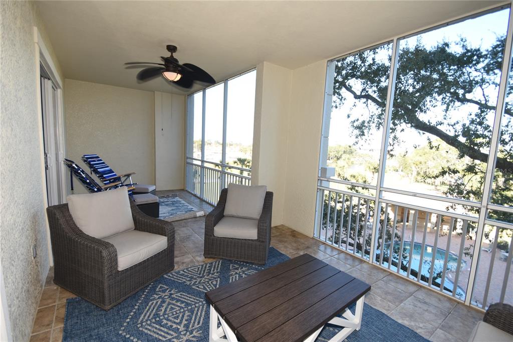 146 Palm Coast Resort Boulevard, Unit 404 Palm Coast, FL 32137 - Photo 25 of 43 a living room with furniture and wooden floor