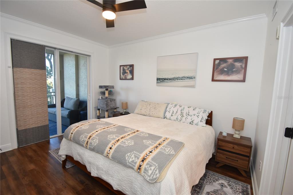 146 Palm Coast Resort Boulevard, Unit 404 Palm Coast, FL 32137 - Photo 27 of 43 a bedroom with a bed and a chandelier