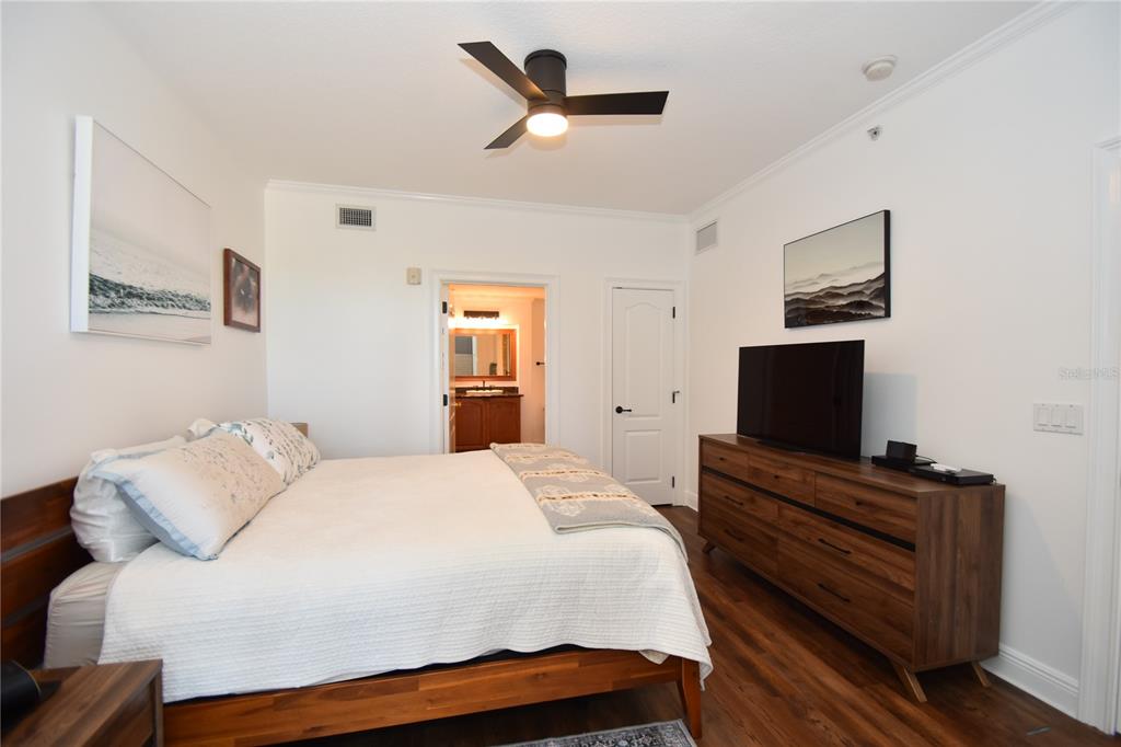 146 Palm Coast Resort Boulevard, Unit 404 Palm Coast, FL 32137 - Photo 28 of 43 a bedroom with a bed and a flat screen tv