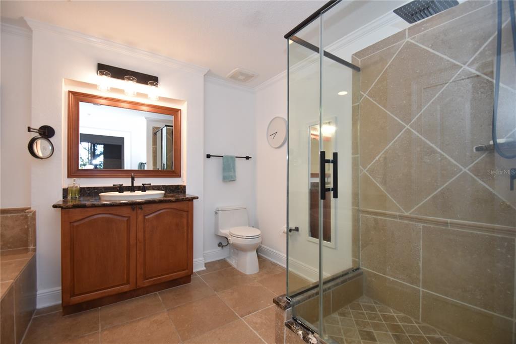 146 Palm Coast Resort Boulevard, Unit 404 Palm Coast, FL 32137 - Photo 30 of 43 a bathroom with a toilet sink and mirror