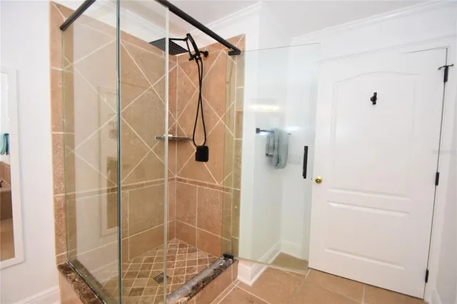 a bedroom with a bed and flat screen tv