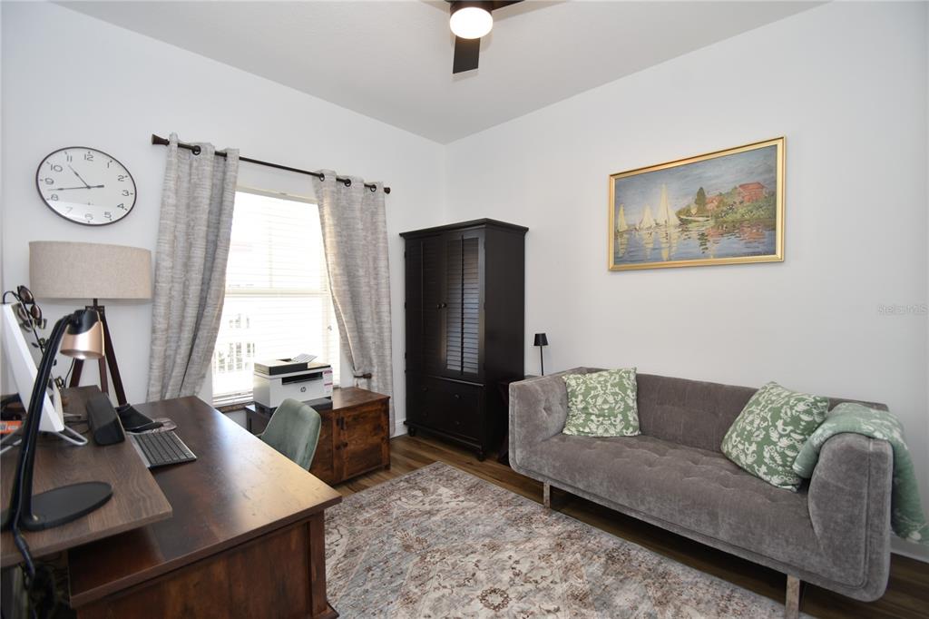 146 Palm Coast Resort Boulevard, Unit 404 Palm Coast, FL 32137 - Photo 38 of 43 a living room with furniture and a window