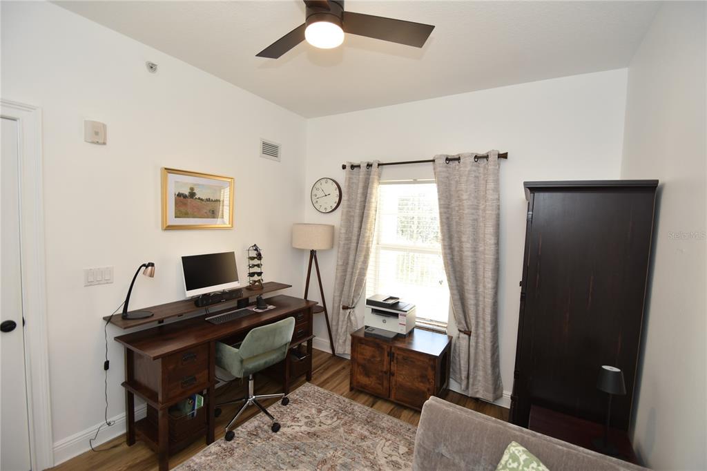 146 Palm Coast Resort Boulevard, Unit 404 Palm Coast, FL 32137 - Photo 39 of 43 a view of a workspace with furniture and a window