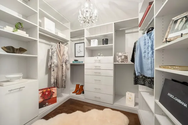 a storage room with cabinets washer and dryer