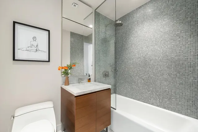 a bathroom with a sink toilet and vanity
