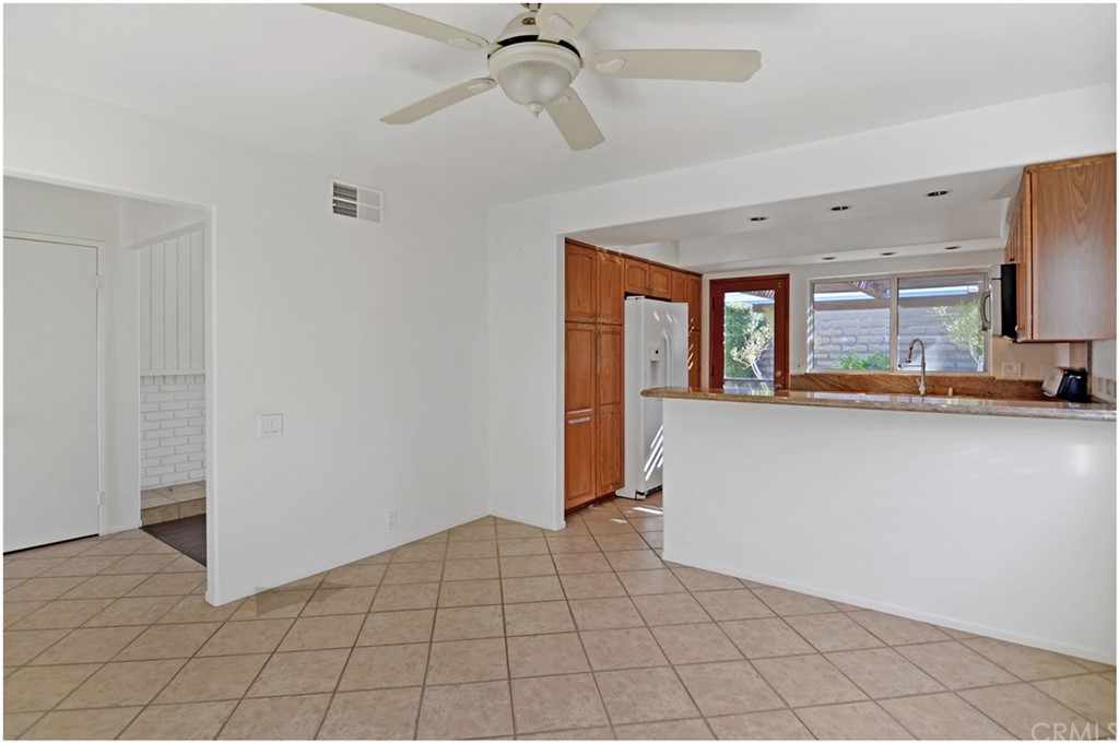 23892 Danzig Bay Dana Point, CA 92629 - Photo 12 of 49 a view of a kitchen with a sink and a refrigerator